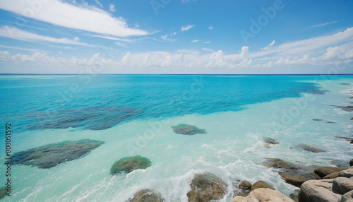 Ocean landscape with turquoise waves and white horse reef