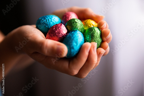 cupped hands filled with Easter eggs photo
