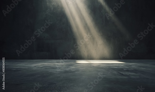 A dark room with a light shining on the floor. The light is coming from a window. The room is empty and has a moody atmosphere, display for product advertising showcase