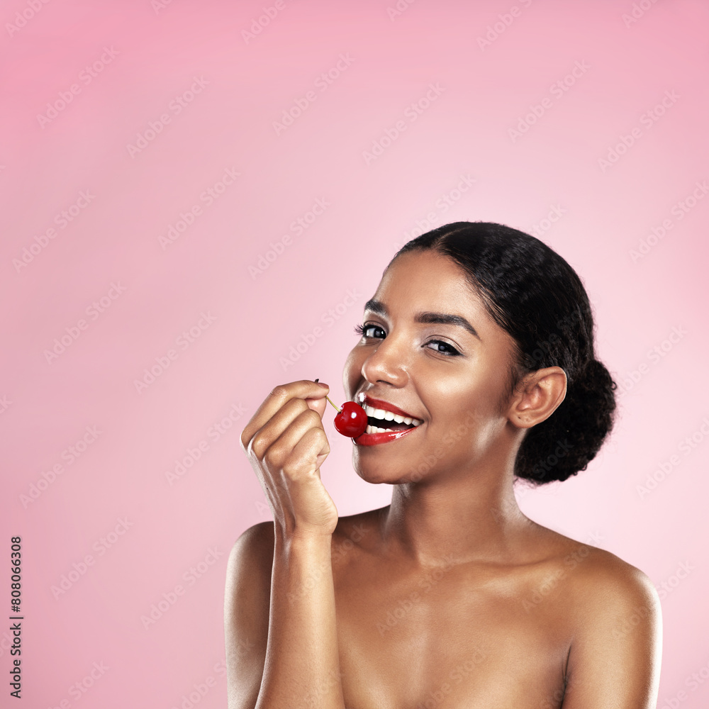 Eating, portrait and black woman with cherry for nutrition, health and healthy diet isolated on pink background. Skin, gen z and girl with fruit for food, wellness and happy on studio backdrop Eating, portrait and black woman with cherry for nutrition, health and healthy diet isolated on pink background. Skin, gen z and girl with fruit for food, wellness and happy on studio backdrop