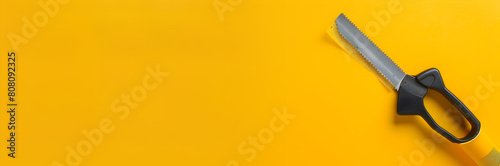 Packing tape cutter web banner. Tape cutter placed on yellow background with copy space.