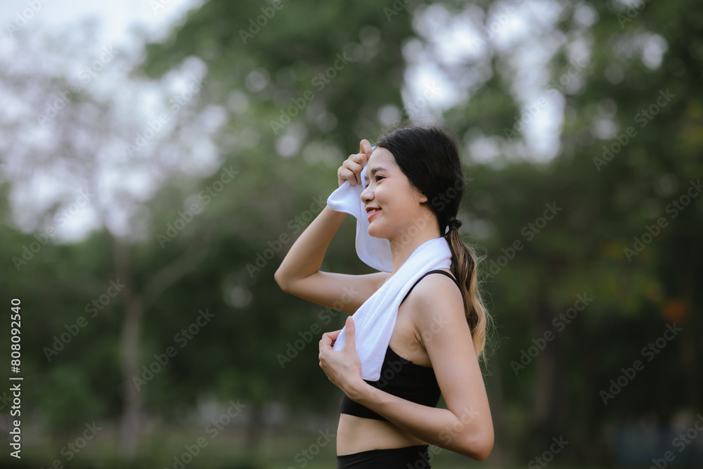 Asian woman exercising in the park Her gaze was determined to lose weight. The concept of healthy lifestyle activities Asian woman exercising in the park Her gaze was determined to lose weight. The concept of healthy lifestyle activities