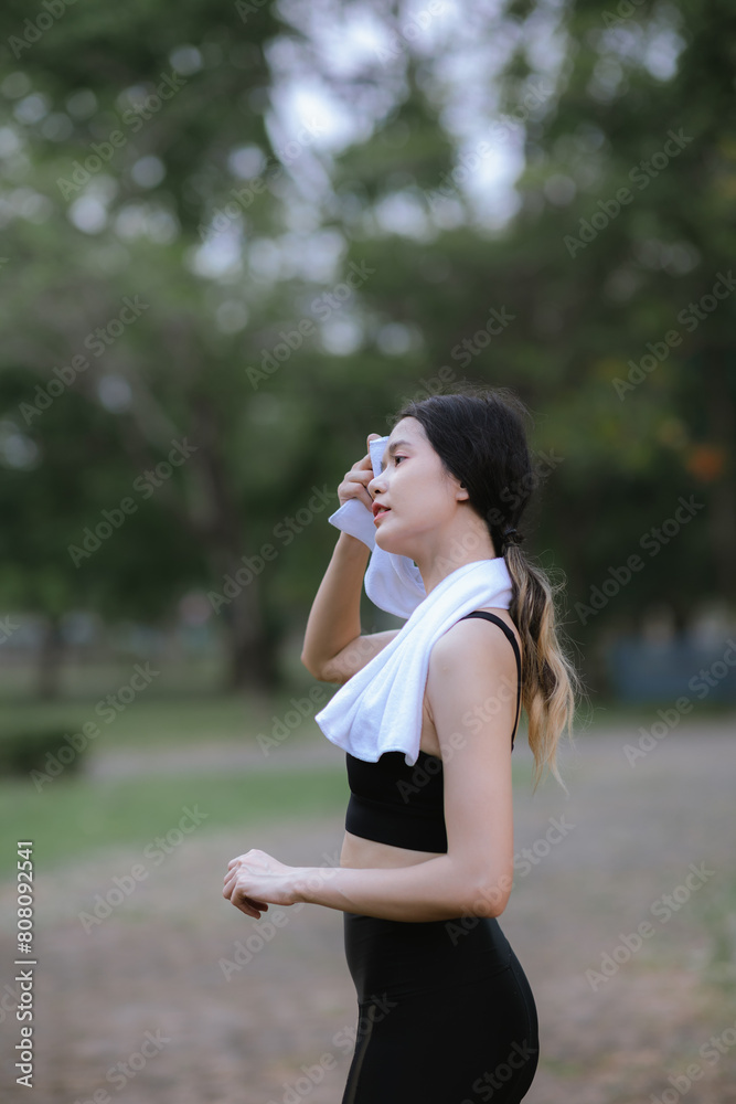 Asian woman exercising in the park Her gaze was determined to lose weight. The concept of healthy lifestyle activities Asian woman exercising in the park Her gaze was determined to lose weight. The concept of healthy lifestyle activities