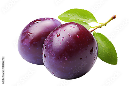 A photo of two ripe plums with water drops on the skin photo