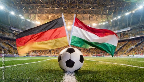 German flag Hungary flag with football in a stadium for the European Championship photo