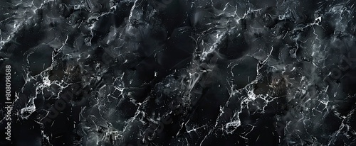 Close up of black marble texture resembling midnight with white veins © Alexei