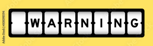 Black color in word warning on slot banner with yellow color background