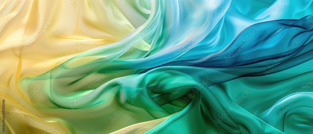 abstract background of a semitransparent silk fabric of ocher blue, cyan, green color abstract background of a semitransparent silk fabric of ocher blue, cyan, green color