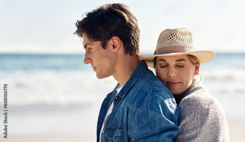 Couple, love and hugging at beach for vacation, summer and smile for anniversary in nature. Man, woman and happiness outdoor for travel, trust and sunshine by ocean with support for adventure
