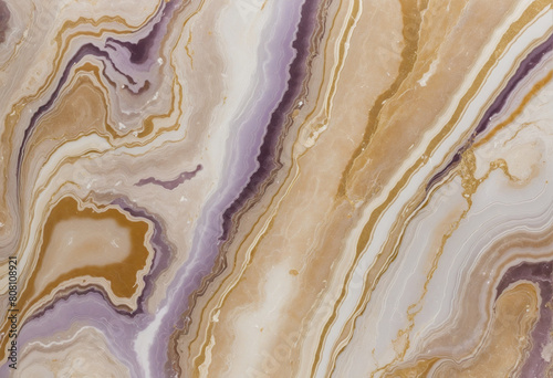 Luxurious marble and gold onyx patterned background with a subtle blend of brown and purple tones