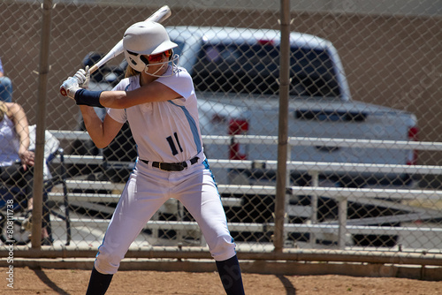 Young Female fastpitch softball player playing club sports.