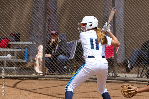 Young Female fastpitch softball player playing club sports.