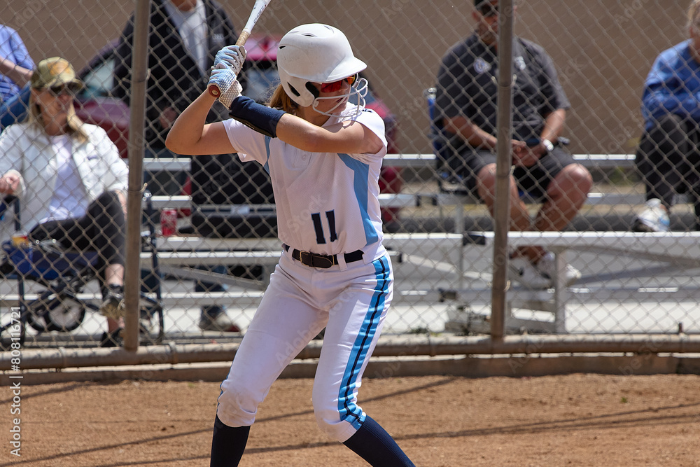Obraz premium Young Female fastpitch softball player playing club sports.