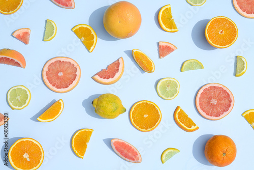 Summer citrus fruit, oranges, lemon and grapefruit on a blue background. Aesthetic natural juicy concept.