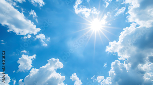 Blue sky with white clouds and sun. The vast blue sky and clouds sky on sunny day. White fluffy clouds in the blue sky.
