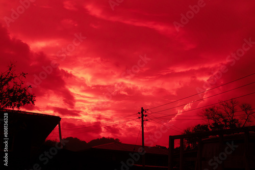Background of sky with red clouds on the coutryside.  photo