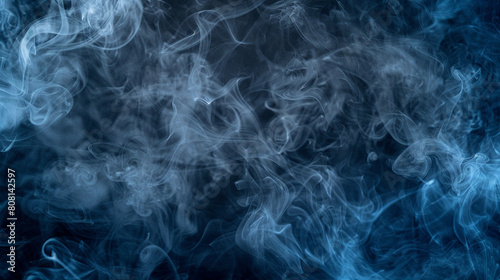 A mysterious and moody scene of smoke in shades of deep blue and gray, swirling in the darkness to create a sense of depth and intrigue.