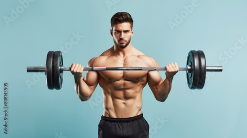 muscular bodybuilder athlete man with perfect body and naked torso exercising with barbell on blue background, bodybuilding athletic male studio shot