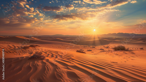 Orange sand in the desert illuminated by the bright scorching sun