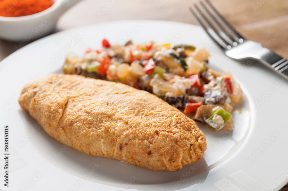 French omelette with sauteed vegetables