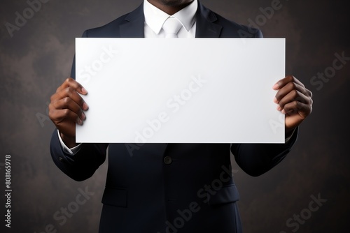 Businessman Holding Blank Signboard