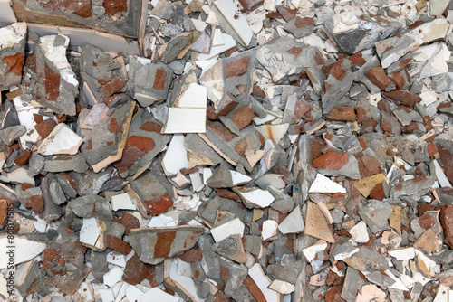 Image description: A pile of broken tiles and debris.