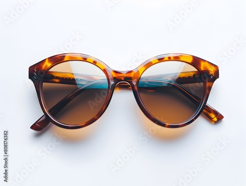 Fashionable Tortoiseshell Sunglasses on White Background Showcasing Chic Eyewear Design and Elegant Styling © Natanong