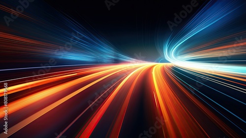 A blurred highway at night, with streaks of light from passing cars creating dynamic lines