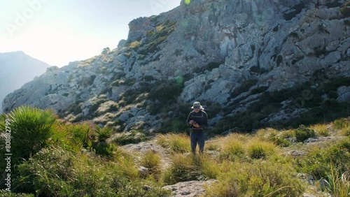 Hiker Navigating Through Ses Coves Blanques, Mallorca photo