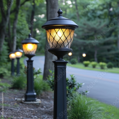 a row of street lights are lit up in front of a road