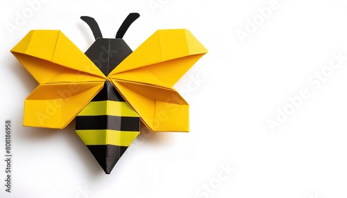 Animal concept origami isolated on white background of a black and yellow striped bumble bee with copy space, simple starter craft for kids