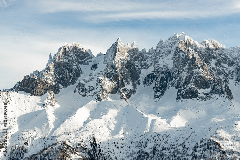 Snow-capped French Alps mountain peaks against clear blue sky
