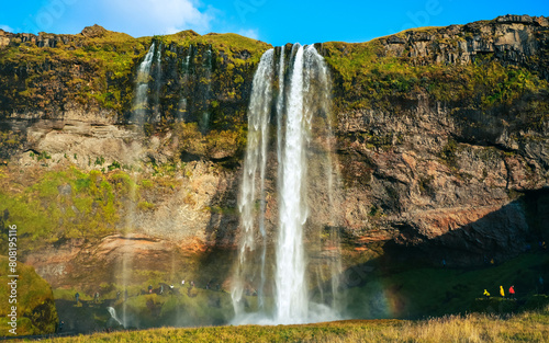 Seljalandsfoss waterfall at sunset. Iceland  huge flow of water 60 meters high. Tourism  nature  wonders  northern lands.