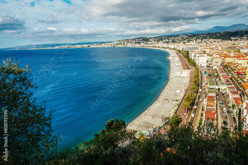 Fantastic Promenade des Anglais, people swimming in Mediterranean Sea and sunbathing on beach - amazing Nice!