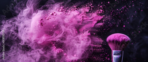 Makeup brush with pink powder explosion on black background, photo