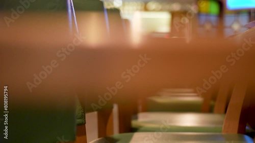 The Interior Of A Pizza Restaurant. wooden leather chairs with green upholstery photo