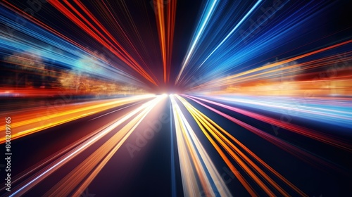 A blurred highway at night  with streaks of light from passing cars creating dynamic lines