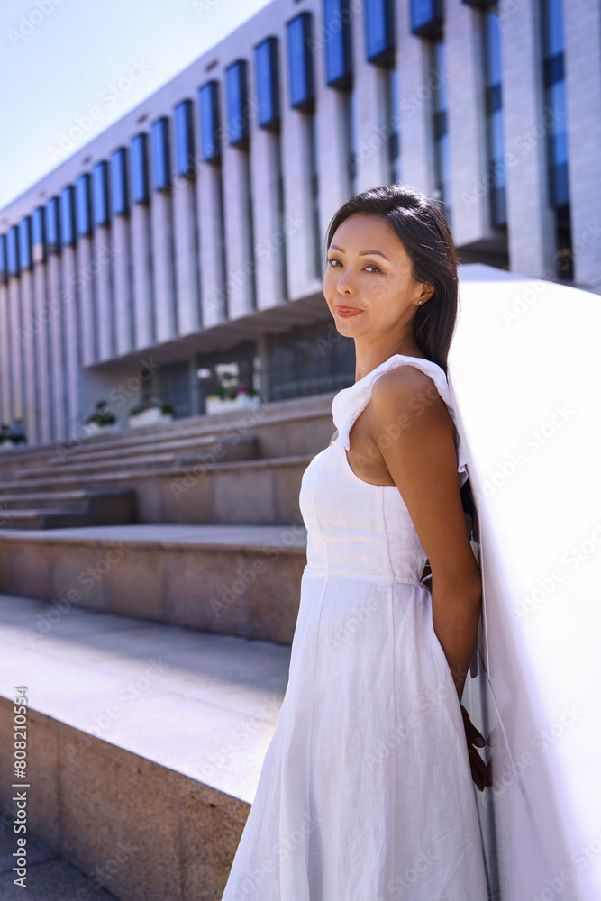 Beautiful woman relaxing while walking in the city Beautiful woman relaxing while walking in the city