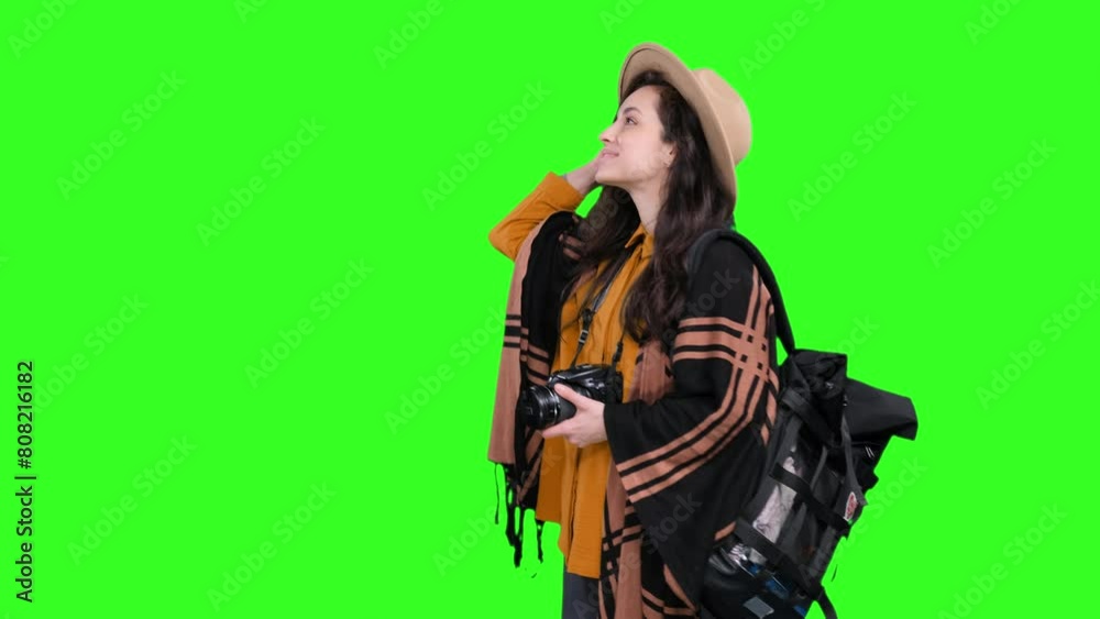 Smiling female tourist taking photo with camera on the chroma key Smiling female tourist taking photo with camera on the chroma key