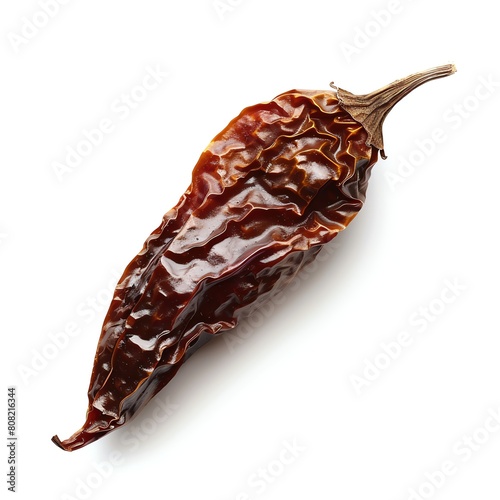 A single chipotle pepper, smoky and dried, isolated on a white background © Nisit