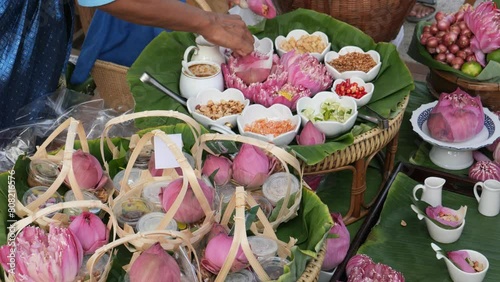 Miang Kham (traditional Southeast Asian herbal snack from Thailand and Laos), Traditional Thai snack. It’s a snack containing different ingredients of herbs and vegetables.  photo
