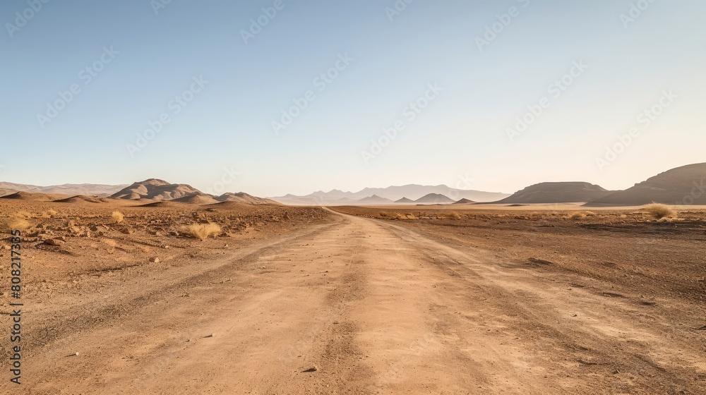 Roman road extending endlessly through a vast desert landscape under the scorching sun Roman road extending endlessly through a vast desert landscape under the scorching sun