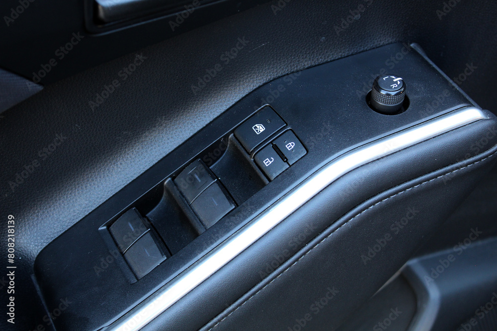 Premium lux car windows control. Business modern car leather Interior. New car windows control panel.
