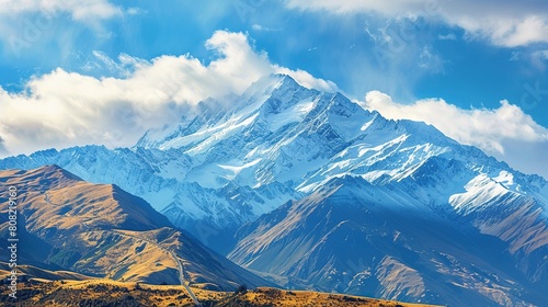 Mountain snowcapped peak isolated on blue sky background, copy space for design, travel concept.