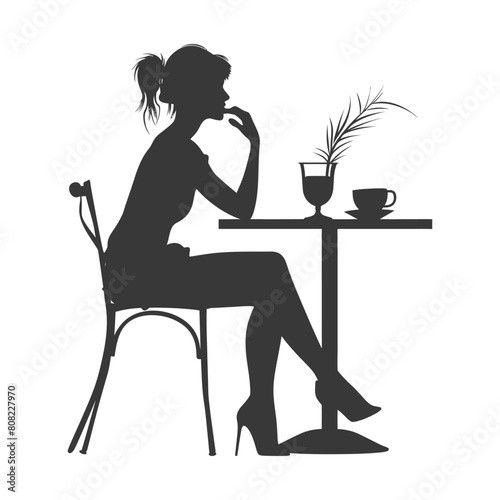 Silhouette woman sitting at a table in the cafe bar restaurant black color only