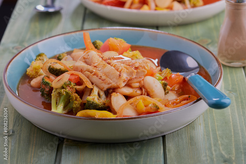 White fish and butter bean stew,with vegetables and a spicy tomato sauce. © Mark