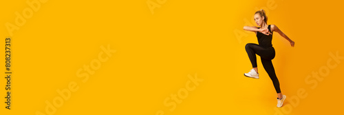 Cardio Workout. Slim Woman Jumping Exercising On Yellow Background In Studio. Sport And Fitness  Web-banner  Copy Space