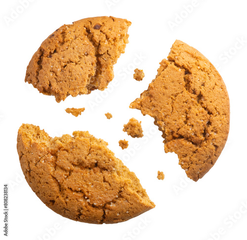 Oatmeal cookies broken into three parts and isolated on a transparent background  top view.