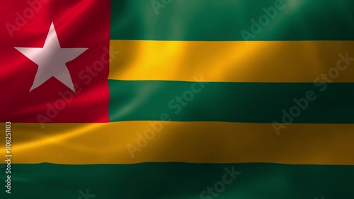 Realistic HD flag of the Togo waving in the wind. Close up of Togo Flag Slow Waving with visible wrinkles. flag background texture with vibrant colors and fabric background
