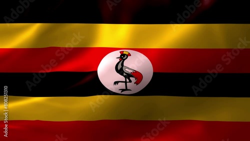 Realistic HD flag of the Uganda waving in the wind. Close up of Uganda Flag Slow Waving with visible wrinkles. flag background texture with vibrant colors and fabric background